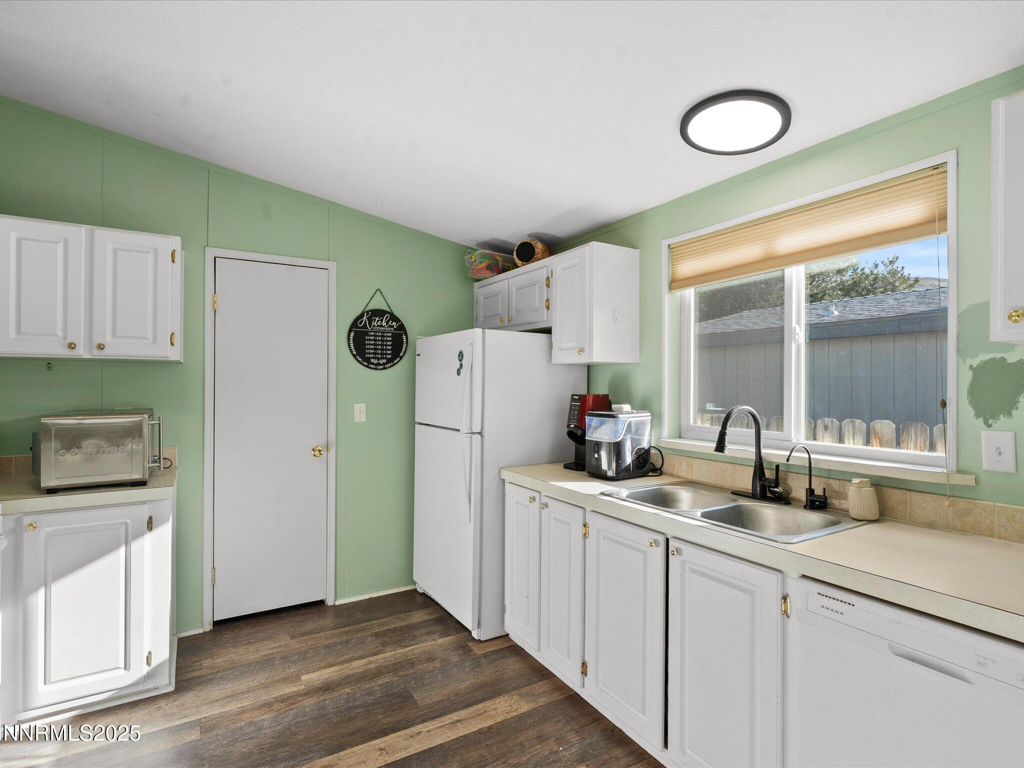 227 Walker Street Gardnerville, NV 89410 - Photo 17 of 33 a kitchen with refrigerator and window