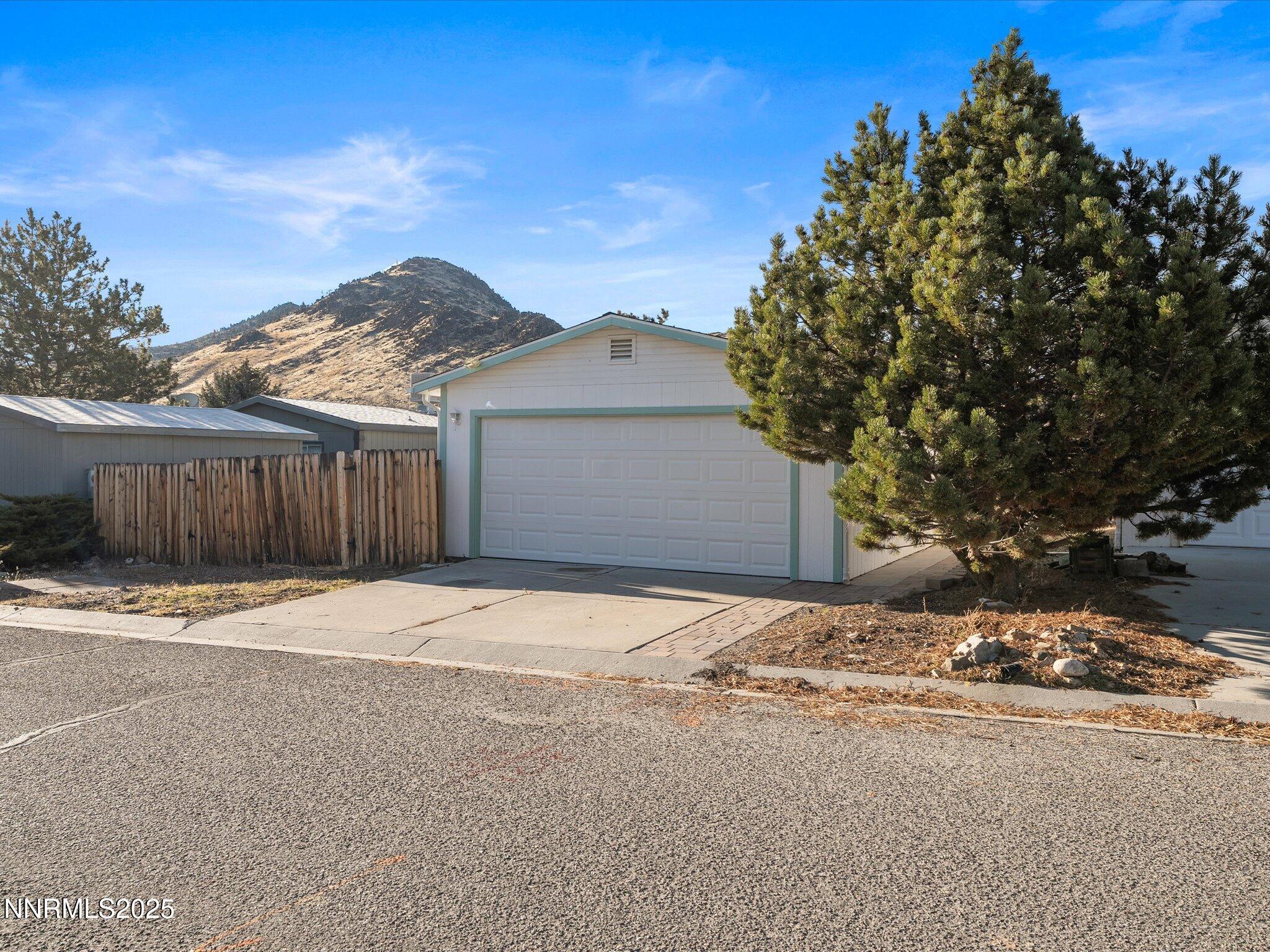 227 Walker Street Gardnerville, NV 89410 - Photo 2 of 33 a front view of a house with a yard