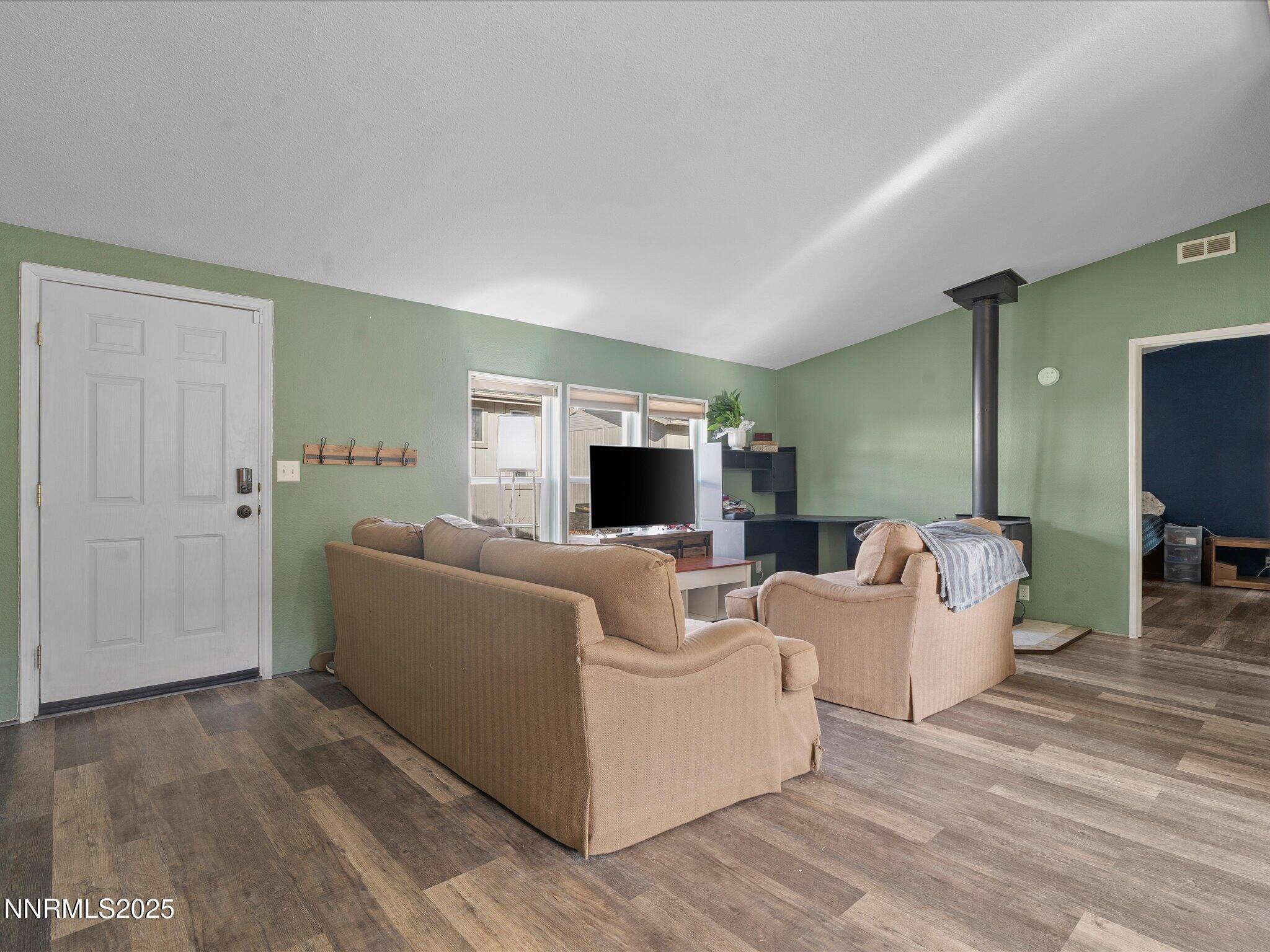 227 Walker Street Gardnerville, NV 89410 - Photo 5 of 33 a living room with furniture and a flat screen tv