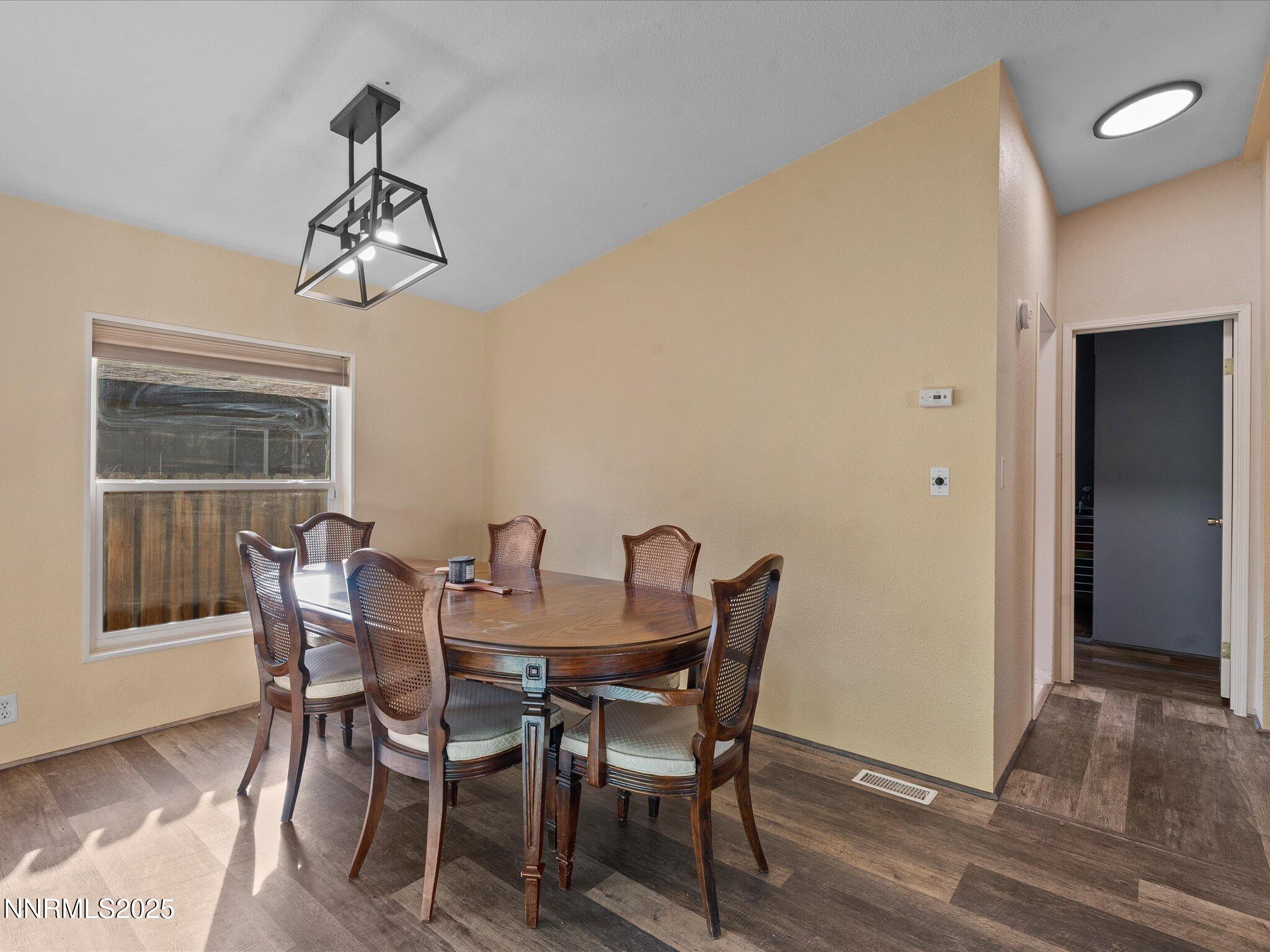 227 Walker Street Gardnerville, NV 89410 - Photo 9 of 33 a view of a dining room with furniture and wooden floor