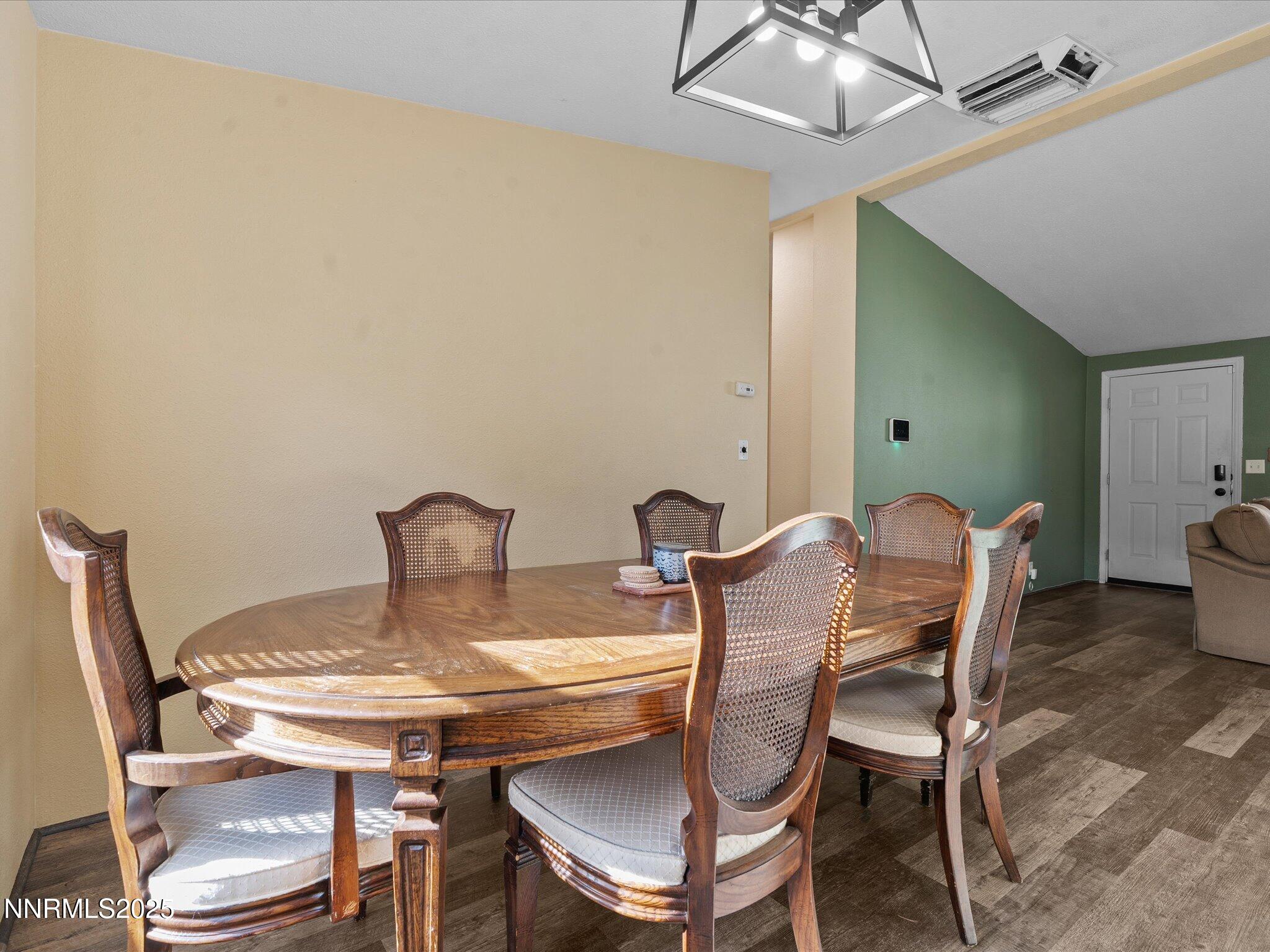 227 Walker Street Gardnerville, NV 89410 - Photo 10 of 33 a view of a dining room with furniture and wooden floor