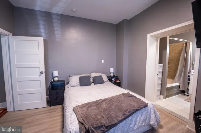 a bedroom with a bed and walk in closet