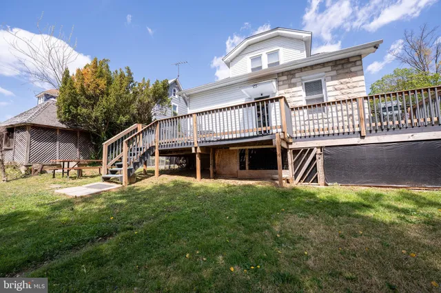 a view of yard with swimming pool and green space