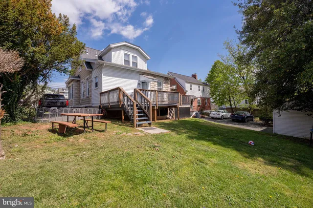a view of a patio with wooden floor