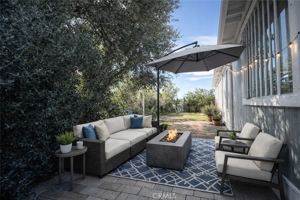 3734 Pacific Street, Unit 40 Highland, CA 92346 - Photo 12 of 15 a patio with patio a table and chairs