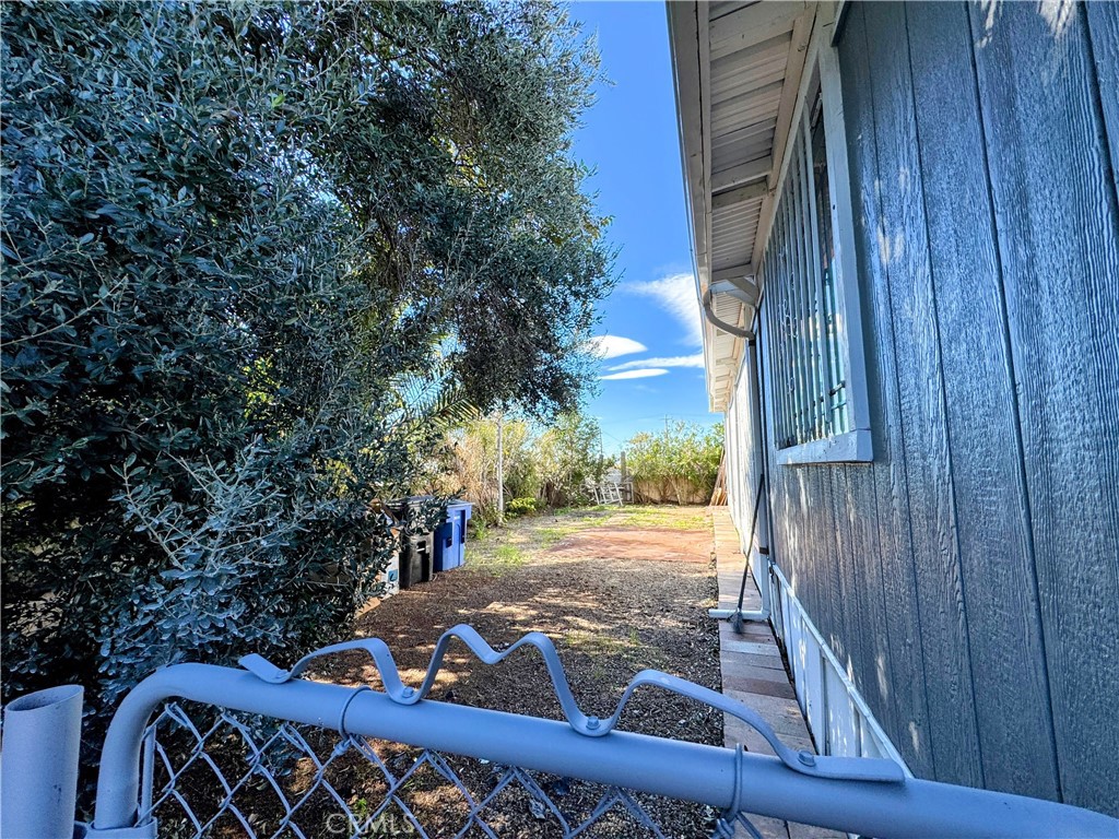 3734 Pacific Street, Unit 40 Highland, CA 92346 - Photo 13 of 15 a view of a wooden door and a yard