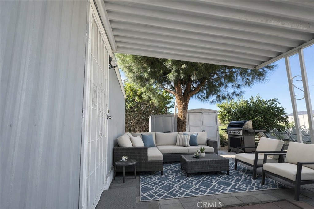 3734 Pacific Street, Unit 40 Highland, CA 92346 - Photo 10 of 15 a living room with furniture and a large window