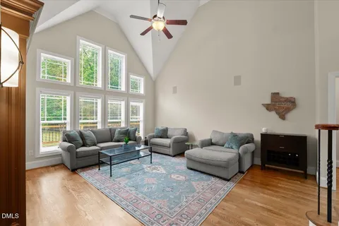 a bed room with a bed and a chair
