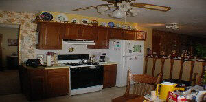8325 Belvidere Road Caledonia, IL 61011 - Photo 4 of 5 a kitchen with stainless steel appliances a stove a refrigerator a sink and a stove