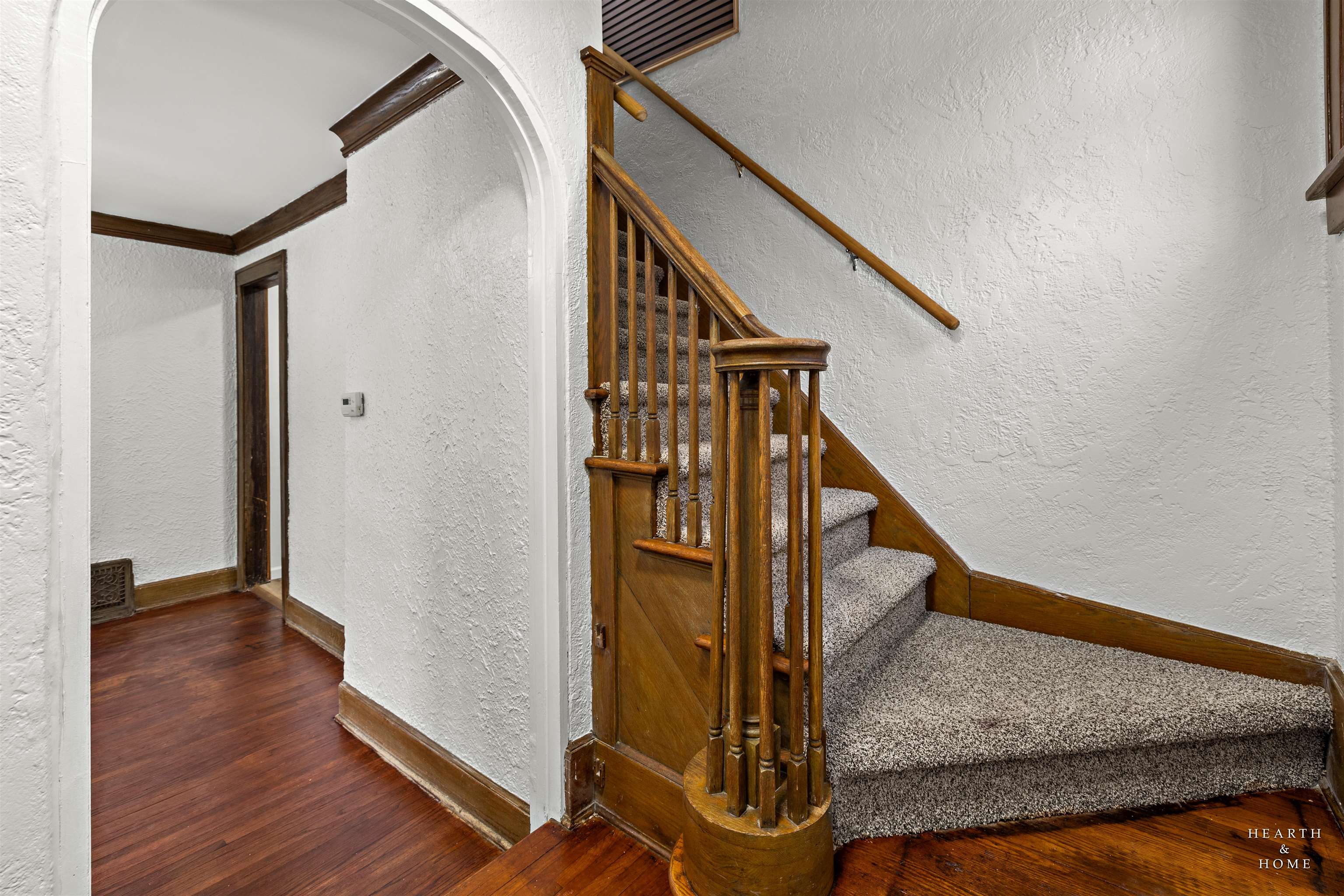 1016 B Street Rockford, IL 61107 - Photo 17 of 38 a view of a hallway with wooden floor and stairs