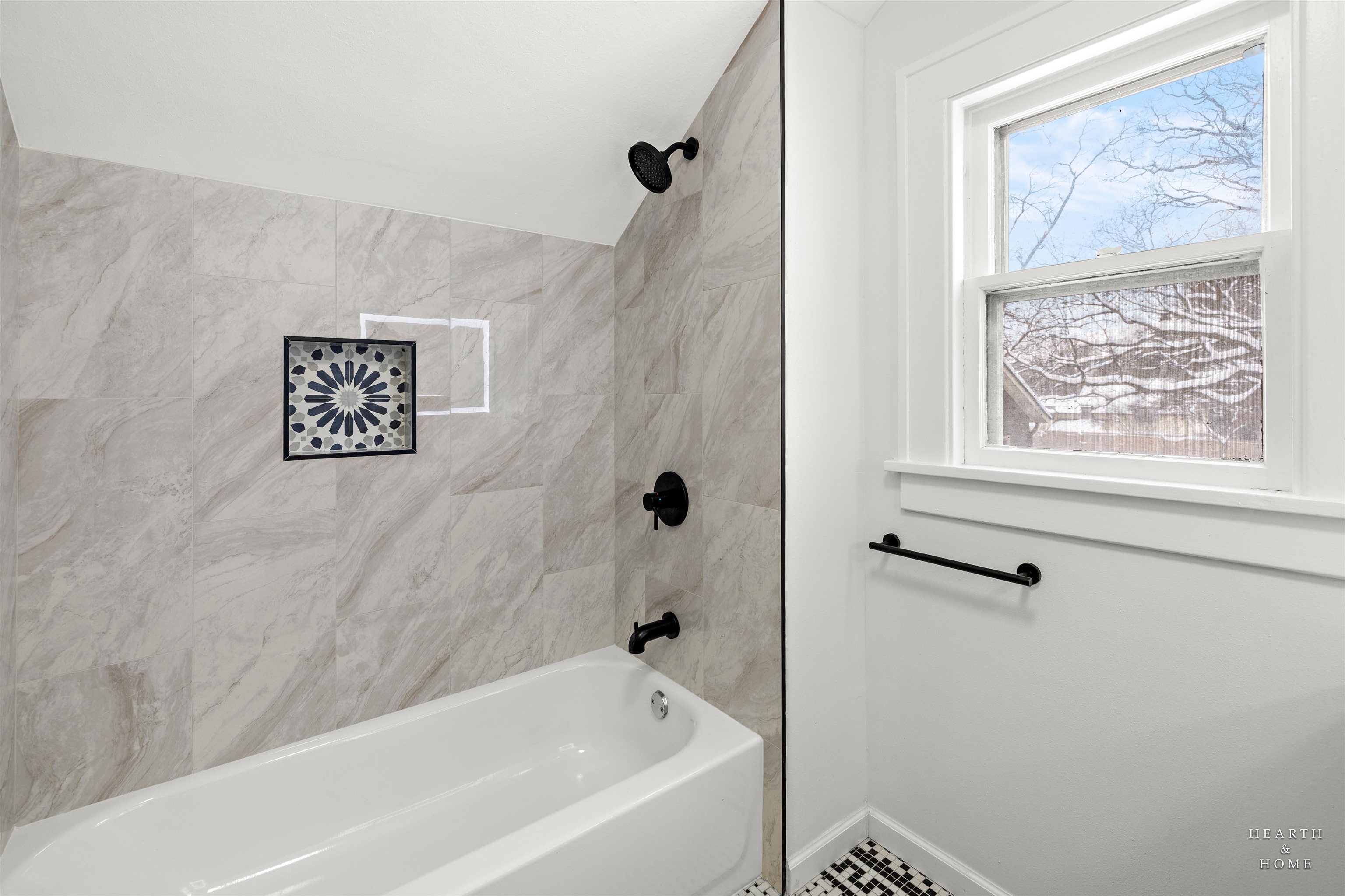1016 B Street Rockford, IL 61107 - Photo 25 of 38 a bathroom with a bathtub and a shower