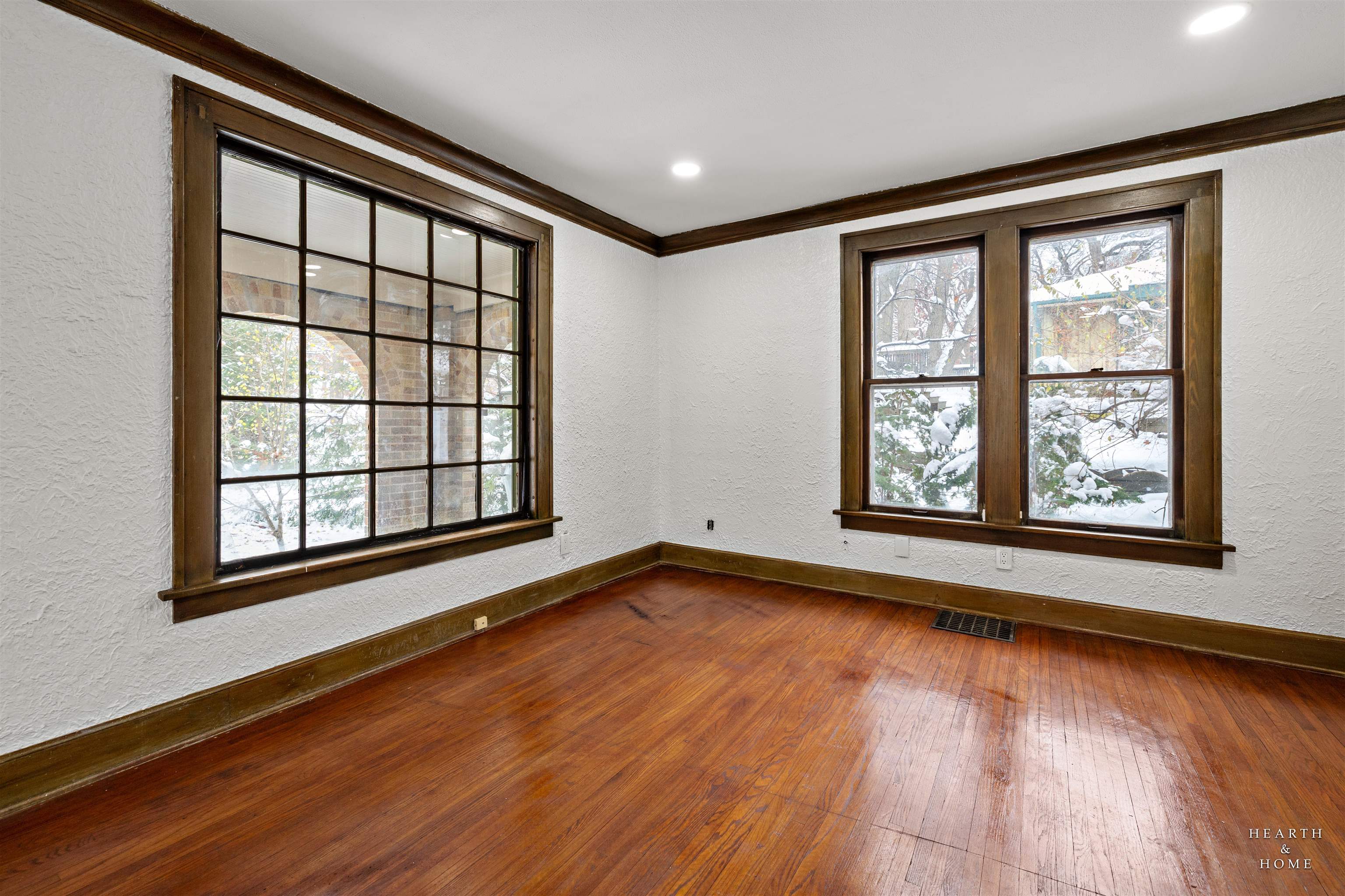 1016 B Street Rockford, IL 61107 - Photo 3 of 38 an empty room with wooden floor and windows