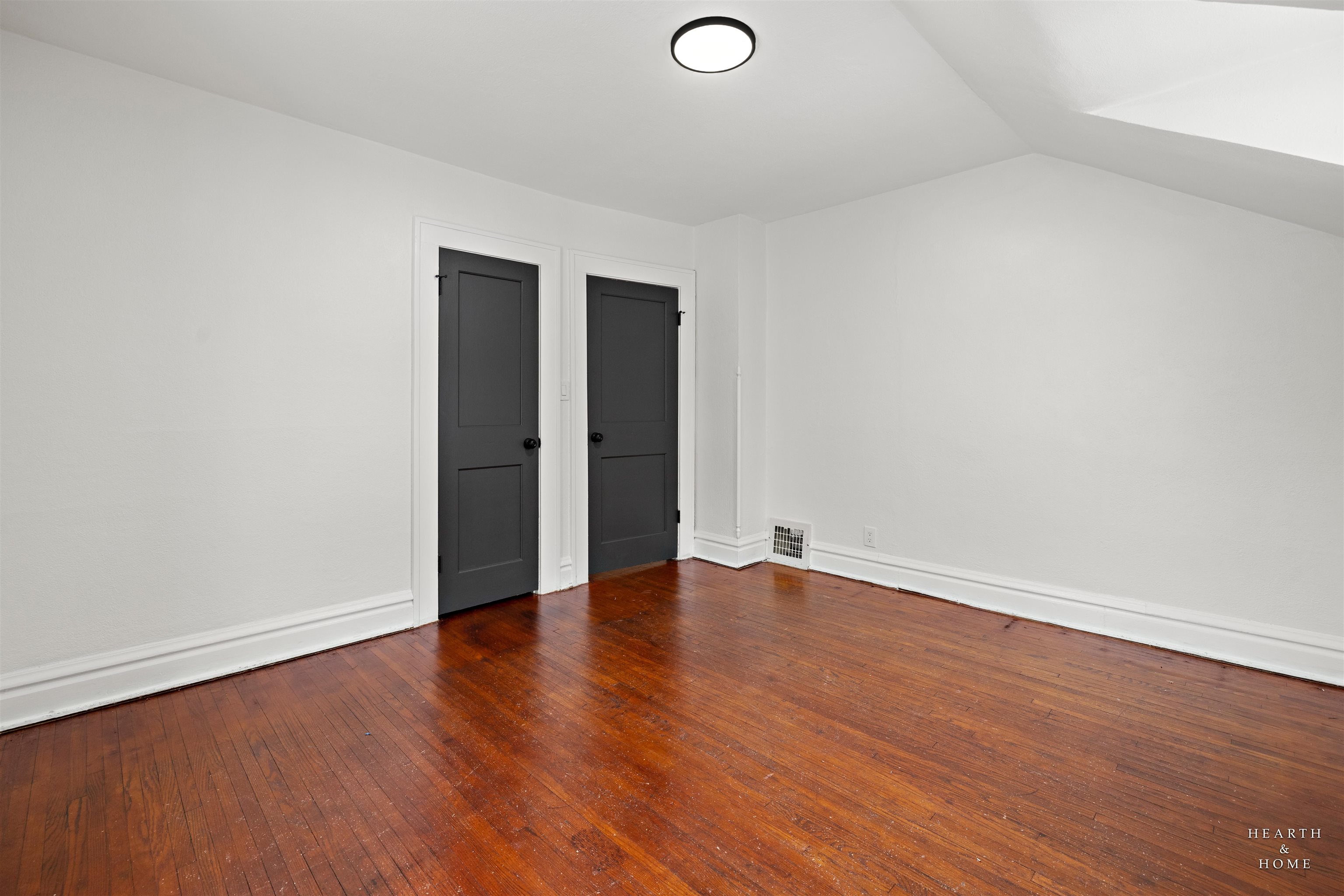 1016 B Street Rockford, IL 61107 - Photo 32 of 38 an empty room with wooden floor and windows