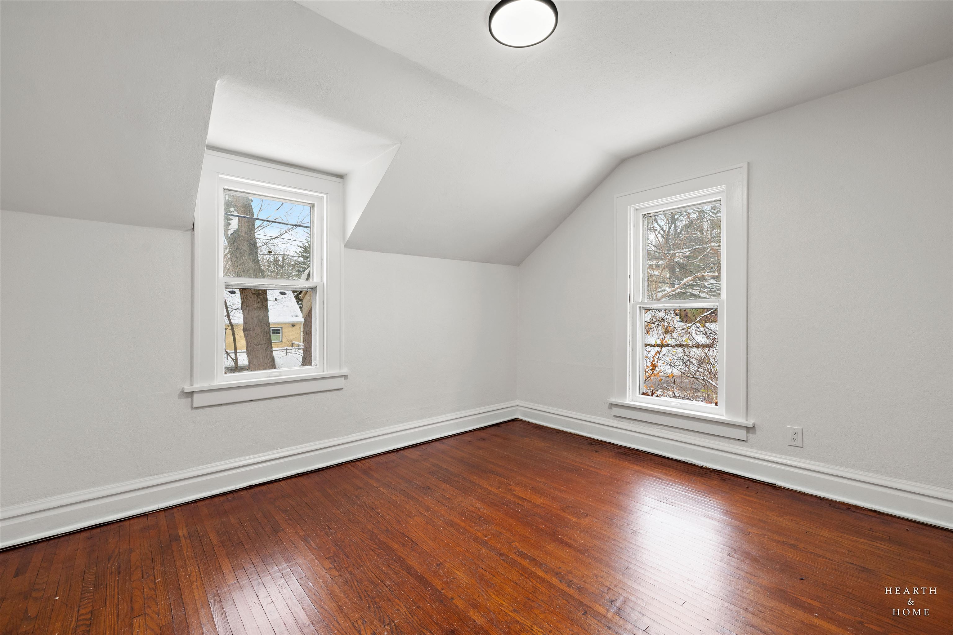 1016 B Street Rockford, IL 61107 - Photo 8 of 38 an empty room with wooden floor and windows