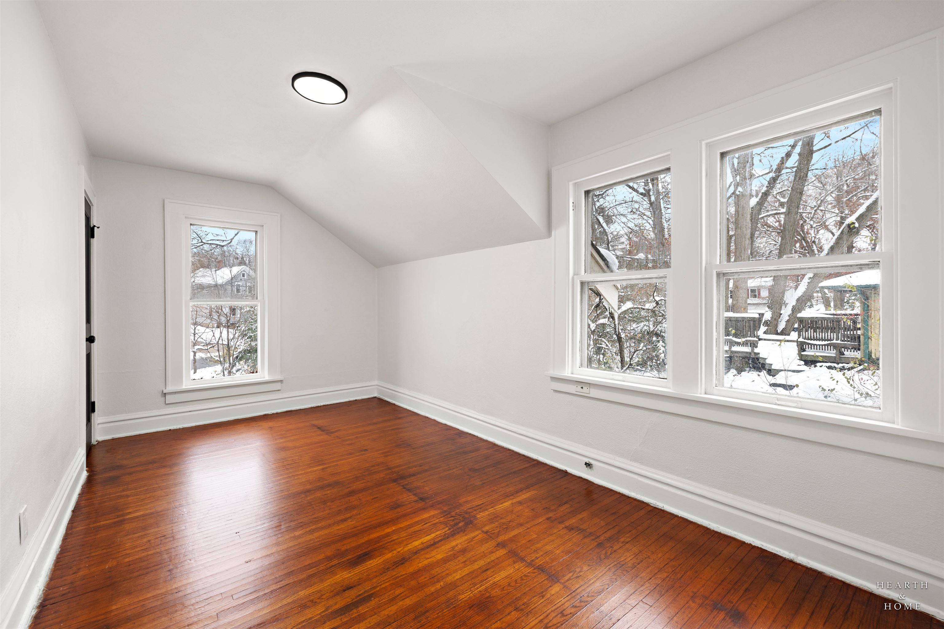 1016 B Street Rockford, IL 61107 - Photo 9 of 38 a view of an empty room with wooden floor and a window