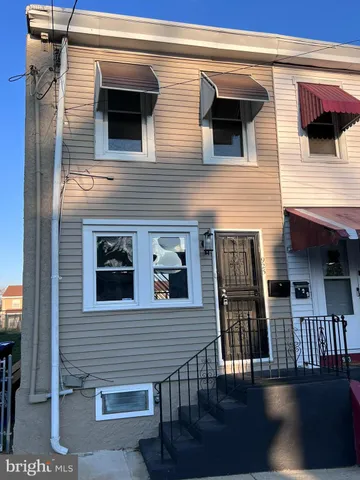 a view of a house with wooden deck