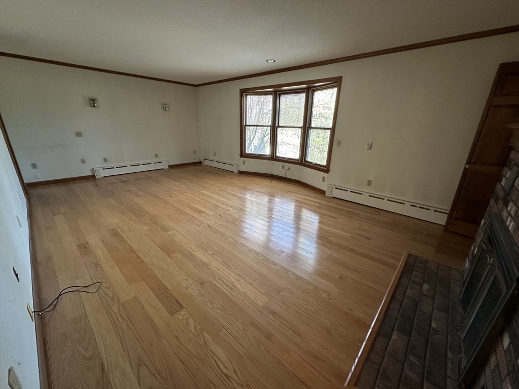 124 Barrington Road Longmeadow, MA 01106 - Photo 11 of 13 an empty room with wooden floor and windows