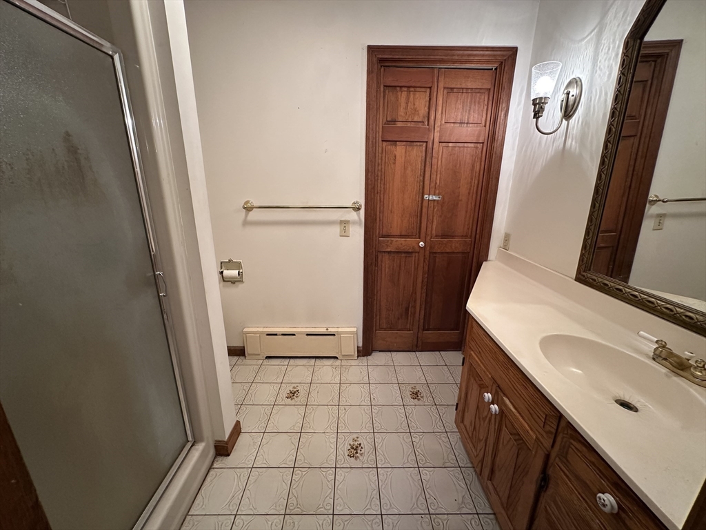 124 Barrington Road Longmeadow, MA 01106 - Photo 12 of 13 a bathroom with a sink a toilet and a mirror