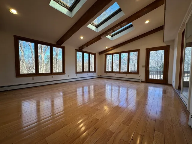 a view of an entryway with wooden floor