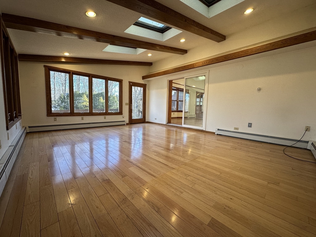 124 Barrington Road Longmeadow, MA 01106 - Photo 4 of 13 an empty room with wooden floor and windows