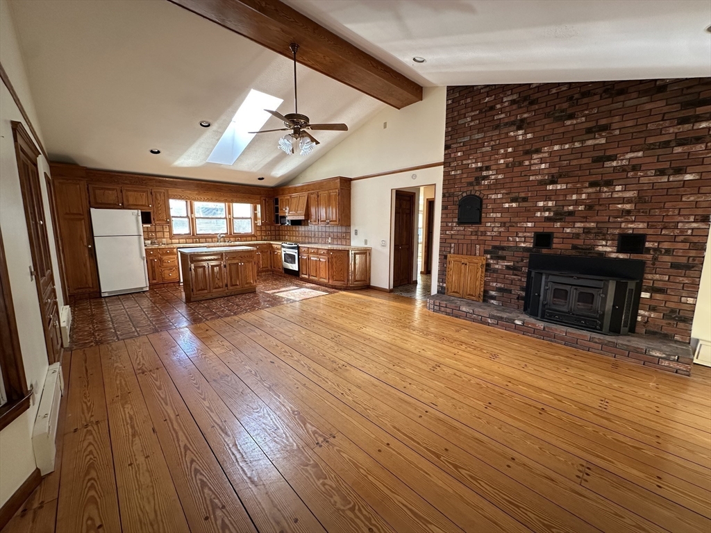 124 Barrington Road Longmeadow, MA 01106 - Photo 5 of 13 a view of a livingroom with furniture a fireplace and wooden floor