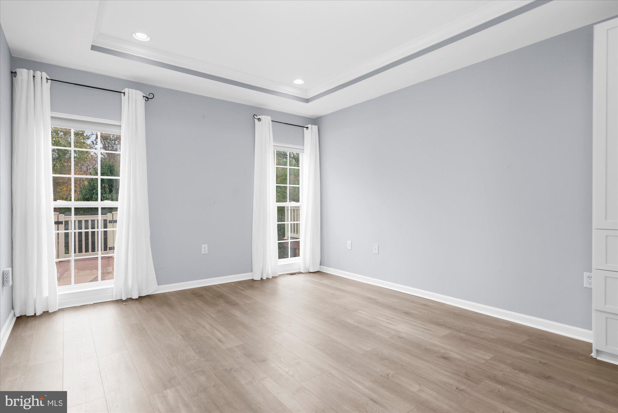 813 Geranium Drive Warrington, PA 18976 - Photo 17 of 44 an empty room with wooden floor and windows
