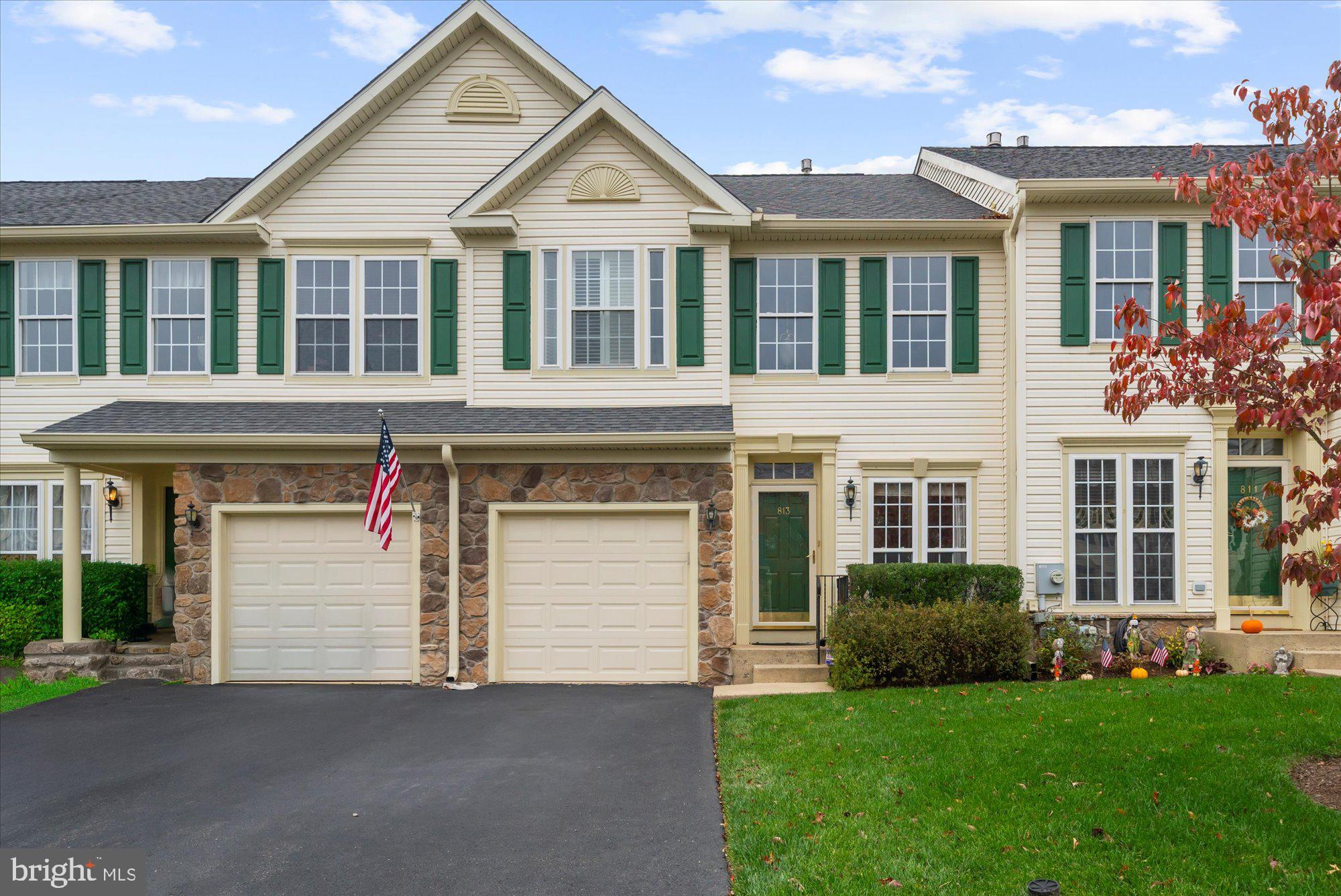 813 Geranium Drive Warrington, PA 18976 - Photo 2 of 44 a front view of a house with a garden and yard