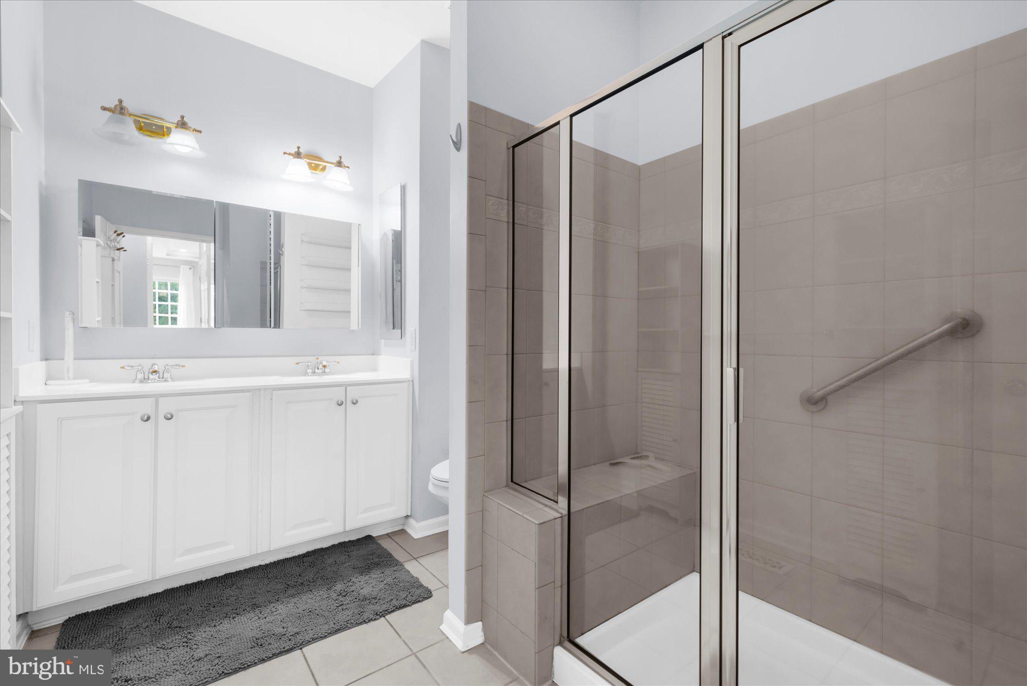 813 Geranium Drive Warrington, PA 18976 - Photo 21 of 44 a bathroom with a shower and a sink