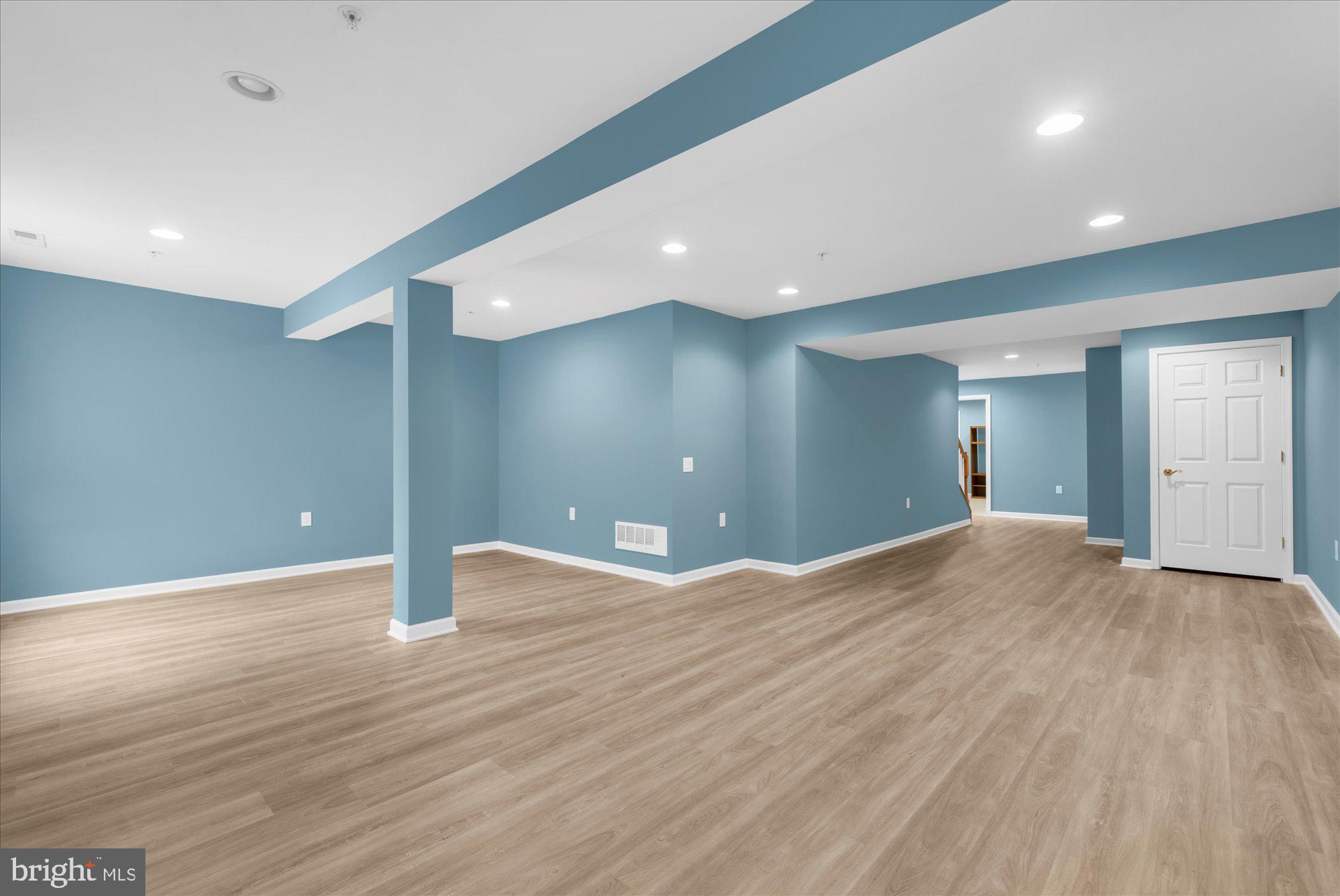 813 Geranium Drive Warrington, PA 18976 - Photo 31 of 44 a view of an empty room with wooden floor