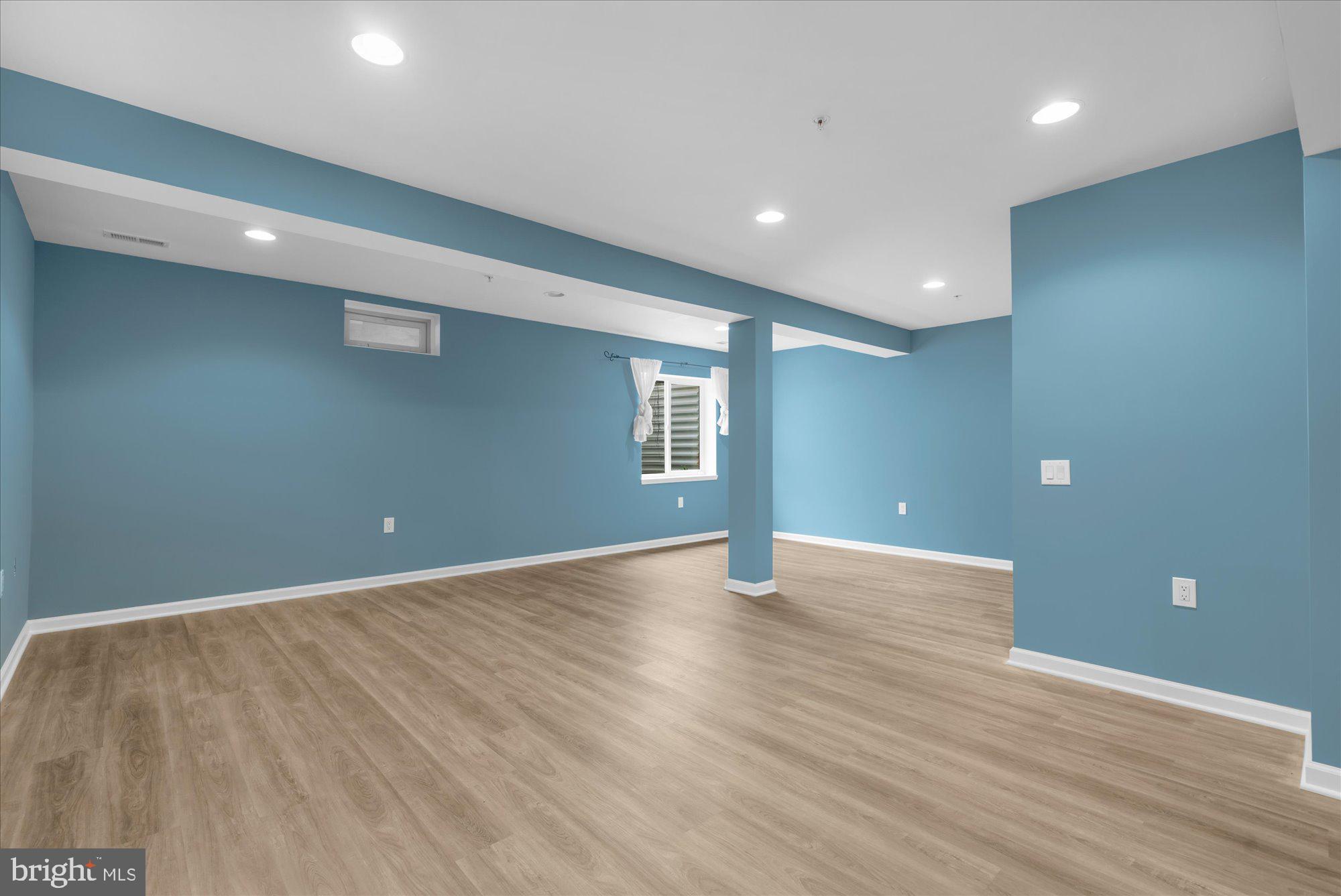 813 Geranium Drive Warrington, PA 18976 - Photo 32 of 44 a view of an empty room with wooden floor and a window