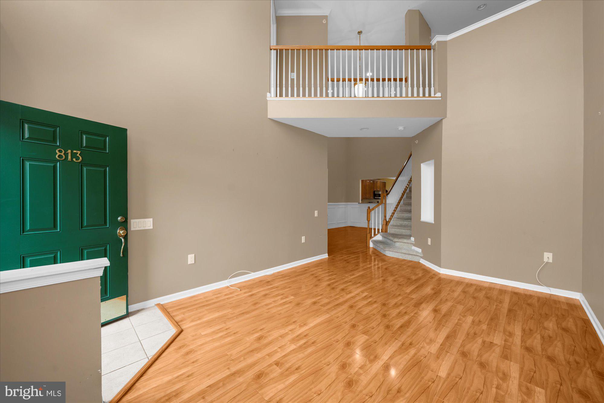 813 Geranium Drive Warrington, PA 18976 - Photo 4 of 44 a view of a bedroom with a wooden floor and a balcony