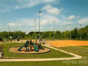 5836 Soft Shell Drive, Unit 286 Lancaster, SC 29720 - Photo 14 of 20 a view of a lake with a big yard