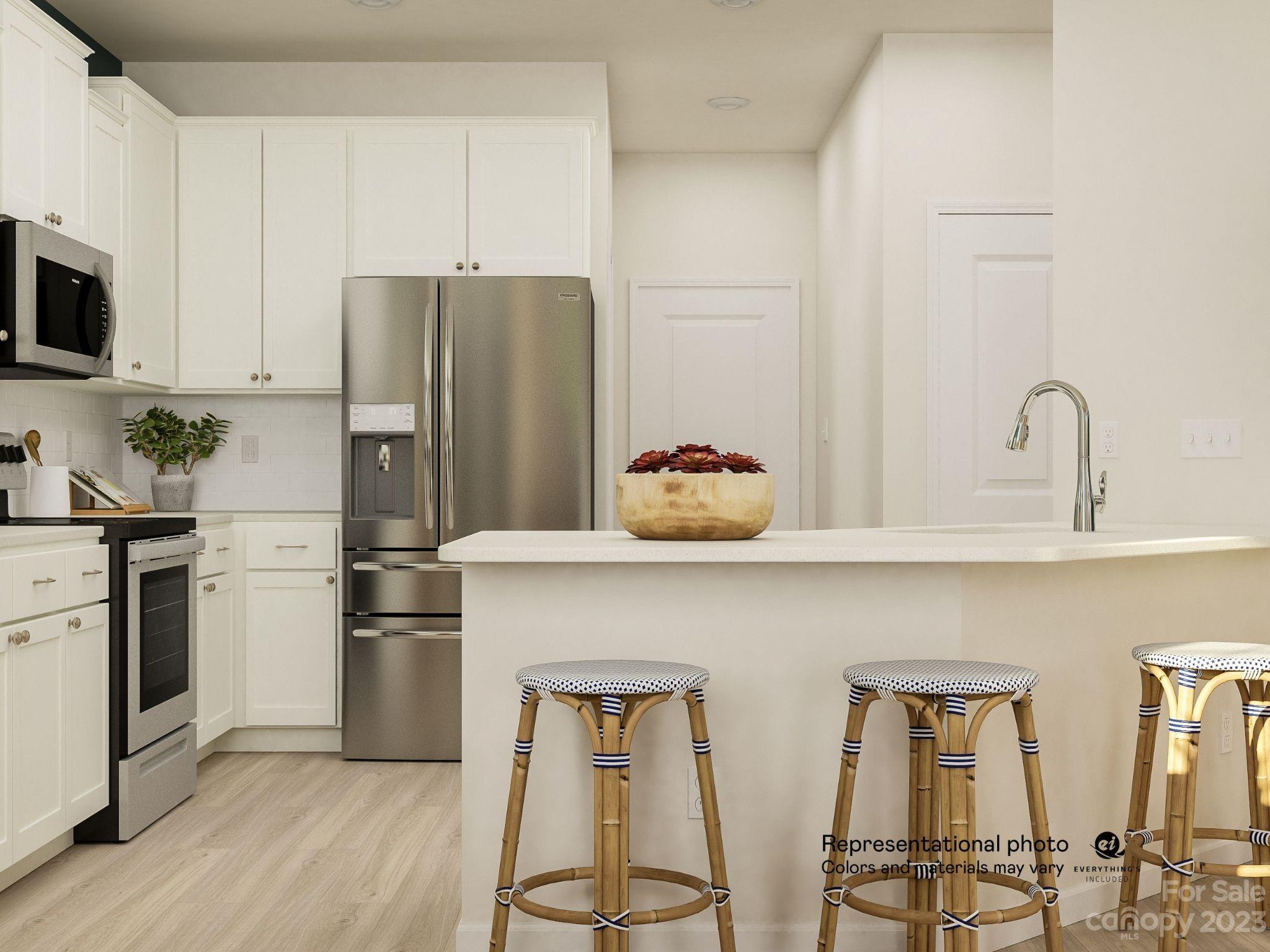 5836 Soft Shell Drive, Unit 286 Lancaster, SC 29720 - Photo 3 of 20 a kitchen with stainless steel appliances a refrigerator and microwave