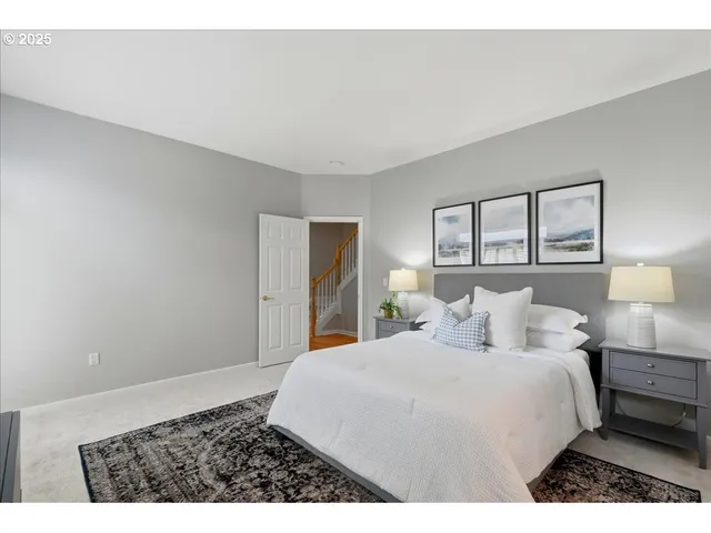 a bedroom with a bed and a night stand