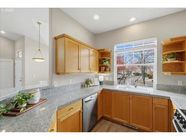 a kitchen with a sink stove and window