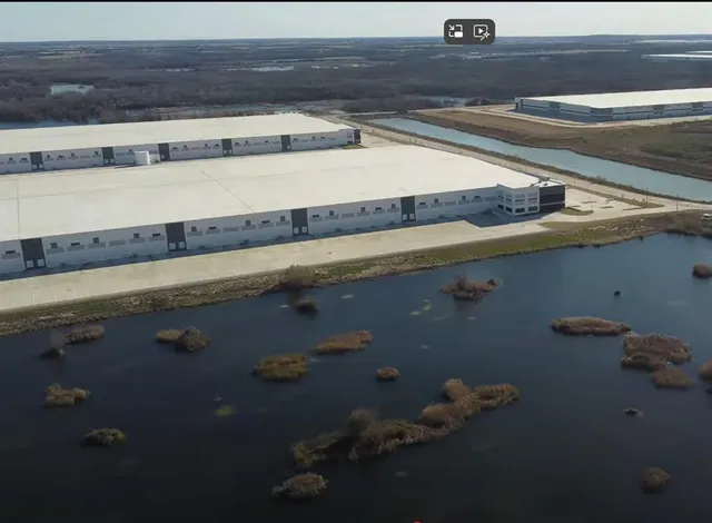 a view of a lake with a house