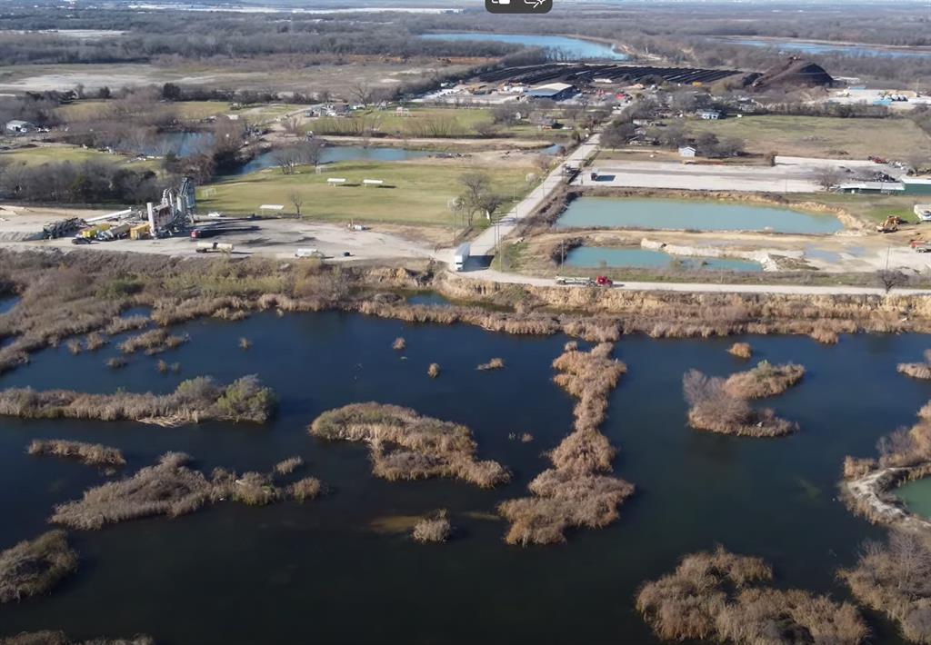 2840 Post Oak Road Wilmer, TX 75172 - Photo 7 of 10 a view of a lake with a house