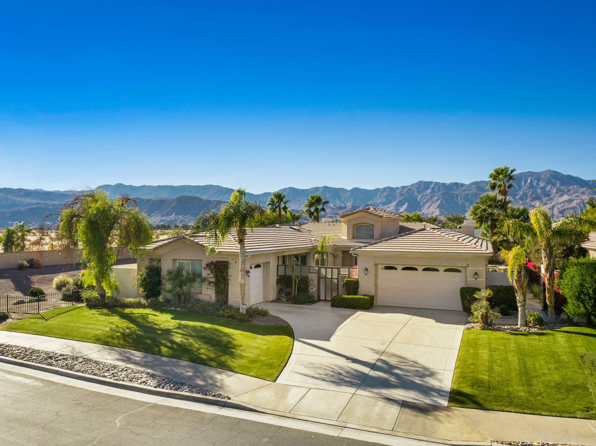 1 Orleans Road Rancho Mirage, CA 92270 - Photo 1 of 50 a view of a house with a yard