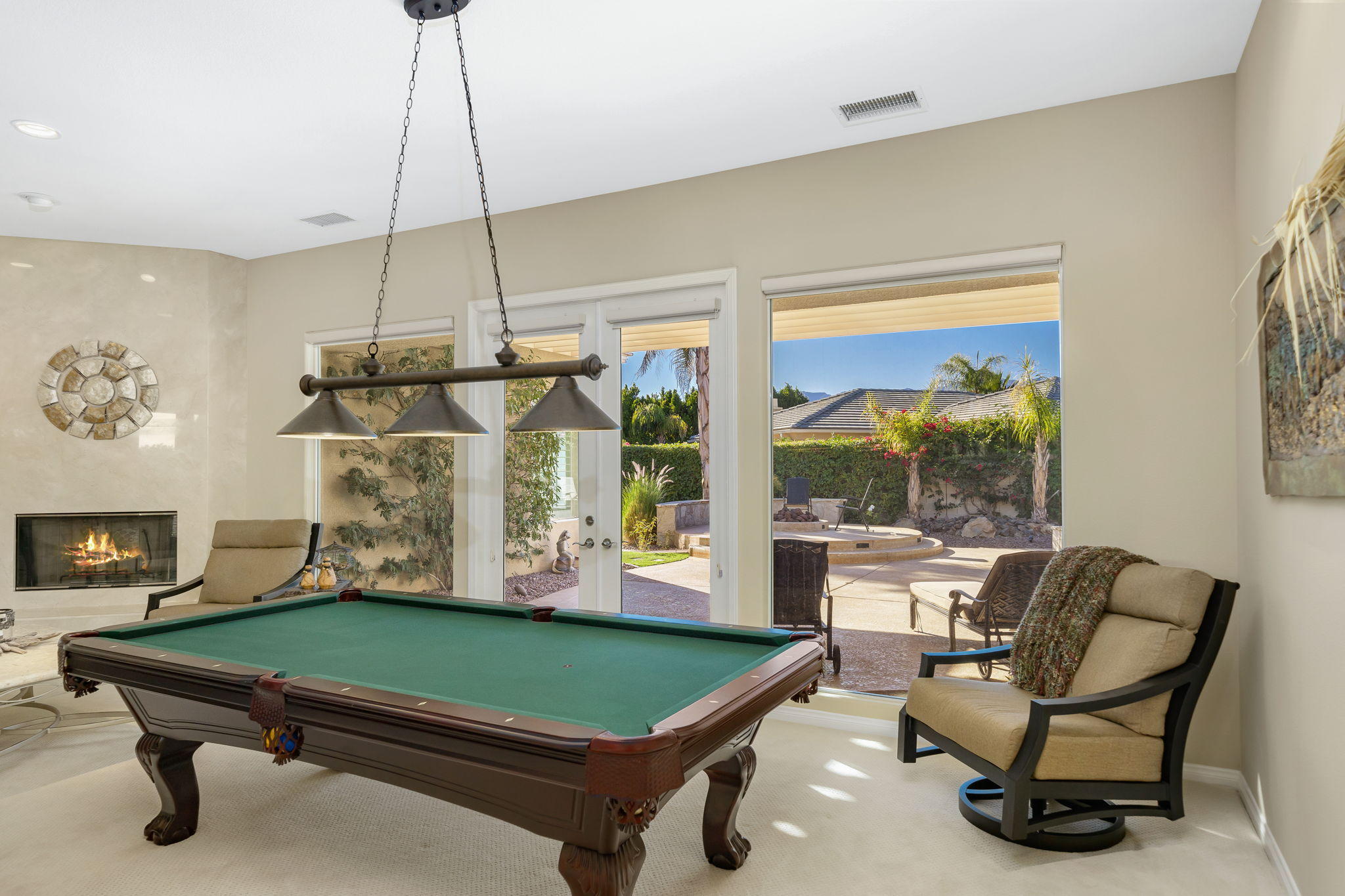 1 Orleans Road Rancho Mirage, CA 92270 - Photo 13 of 50 a room with pool tables and windows
