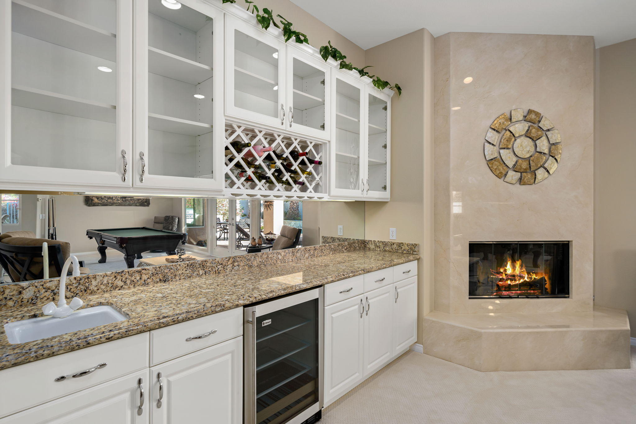 1 Orleans Road Rancho Mirage, CA 92270 - Photo 14 of 50 a kitchen with a stove and a white cabinets