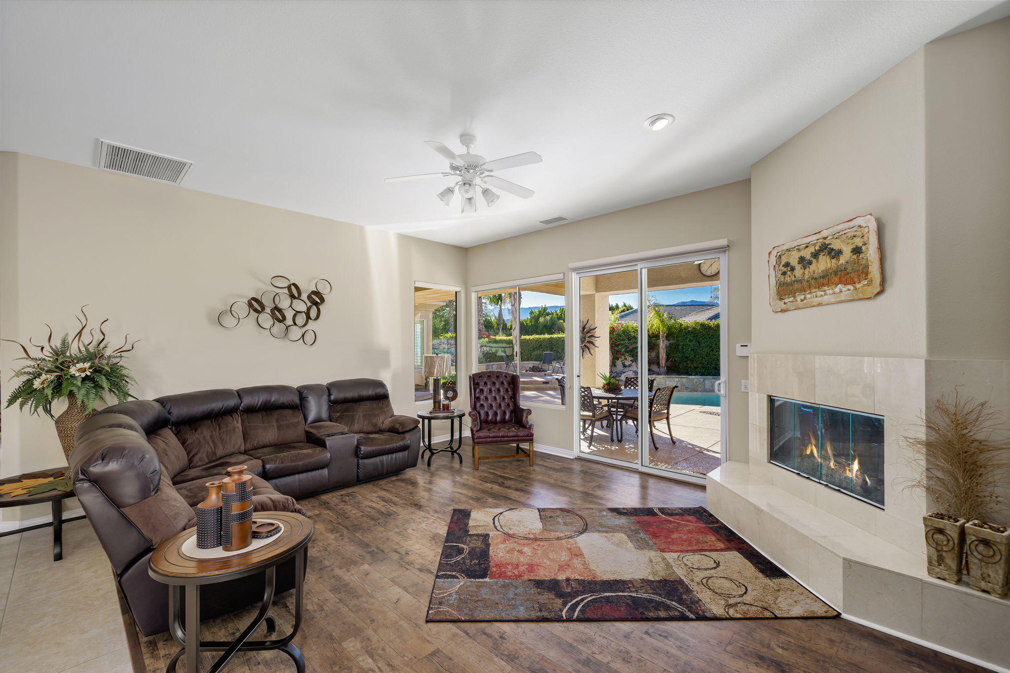 1 Orleans Road Rancho Mirage, CA 92270 - Photo 20 of 50 a living room with furniture large window and a fireplace