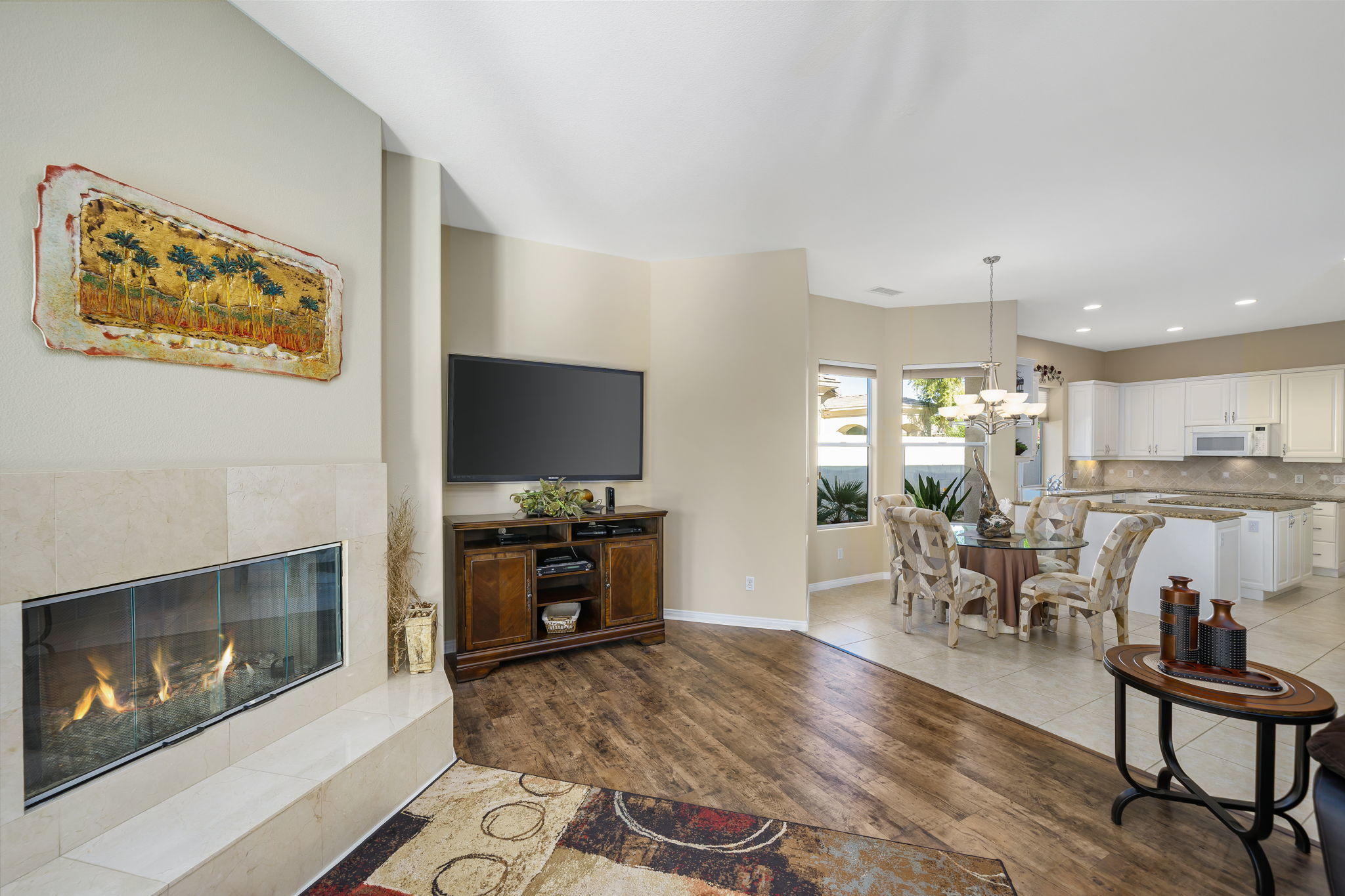 1 Orleans Road Rancho Mirage, CA 92270 - Photo 23 of 50 a living room with furniture a flat screen tv and kitchen view