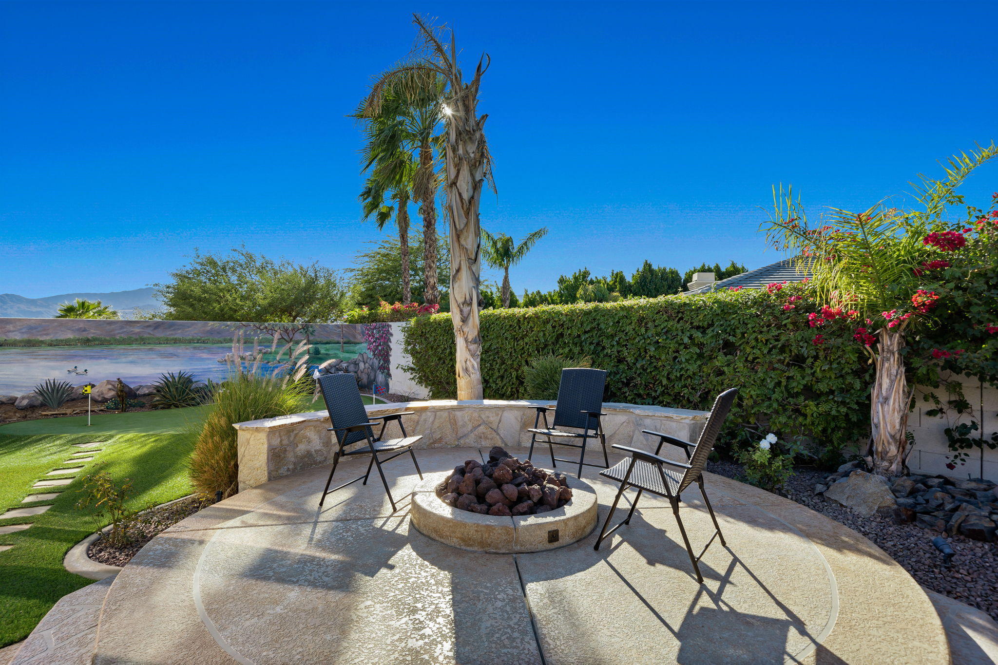 1 Orleans Road Rancho Mirage, CA 92270 - Photo 31 of 50 a view of a patio with swimming pool and furniture