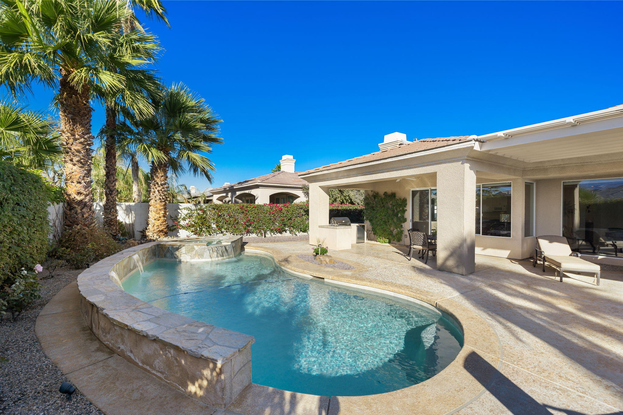 1 Orleans Road Rancho Mirage, CA 92270 - Photo 36 of 50 a view of a house with pool fire pit and sitting area