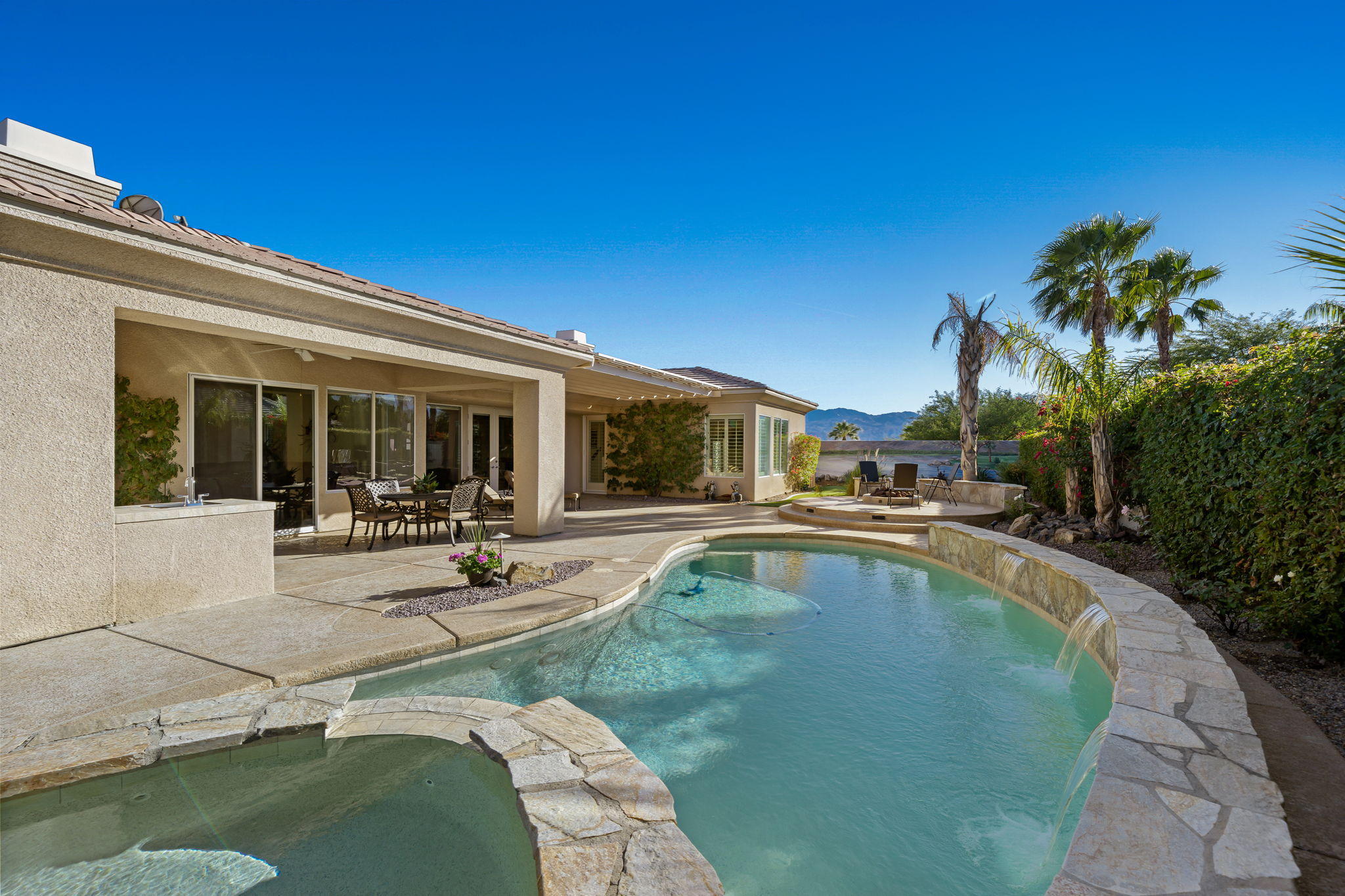 1 Orleans Road Rancho Mirage, CA 92270 - Photo 38 of 50 a view of a house with swimming pool and sitting area