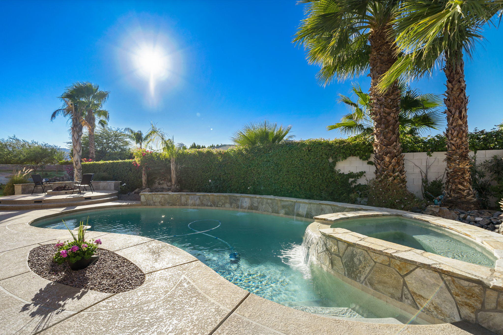 1 Orleans Road Rancho Mirage, CA 92270 - Photo 39 of 50 a view of a swimming pool with a yard