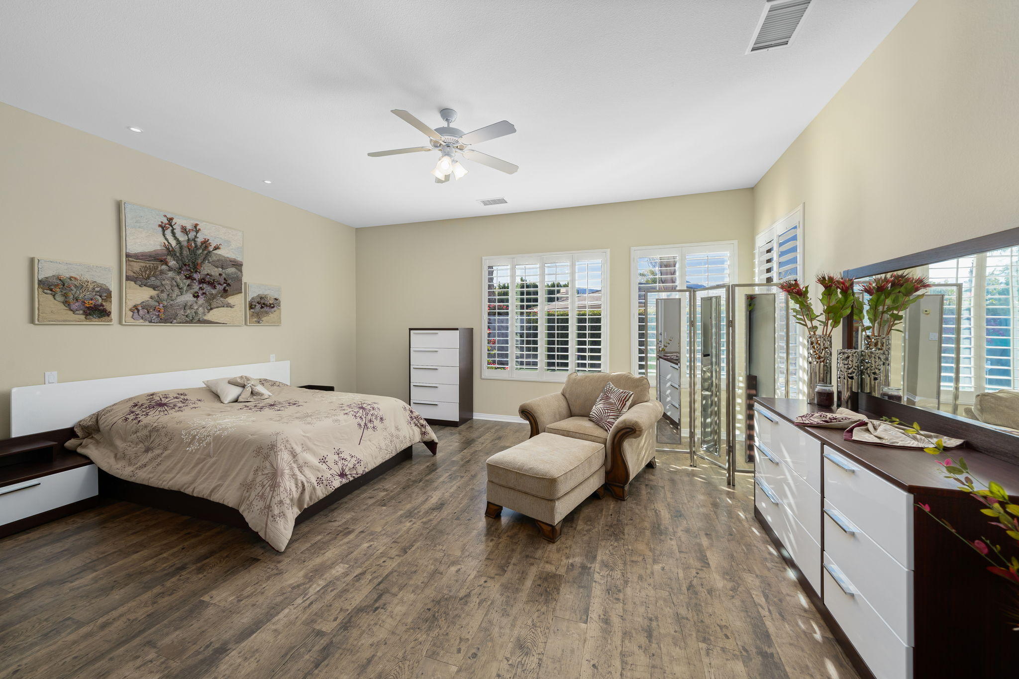 1 Orleans Road Rancho Mirage, CA 92270 - Photo 40 of 50 a spacious bedroom with a bed a couch and a large window