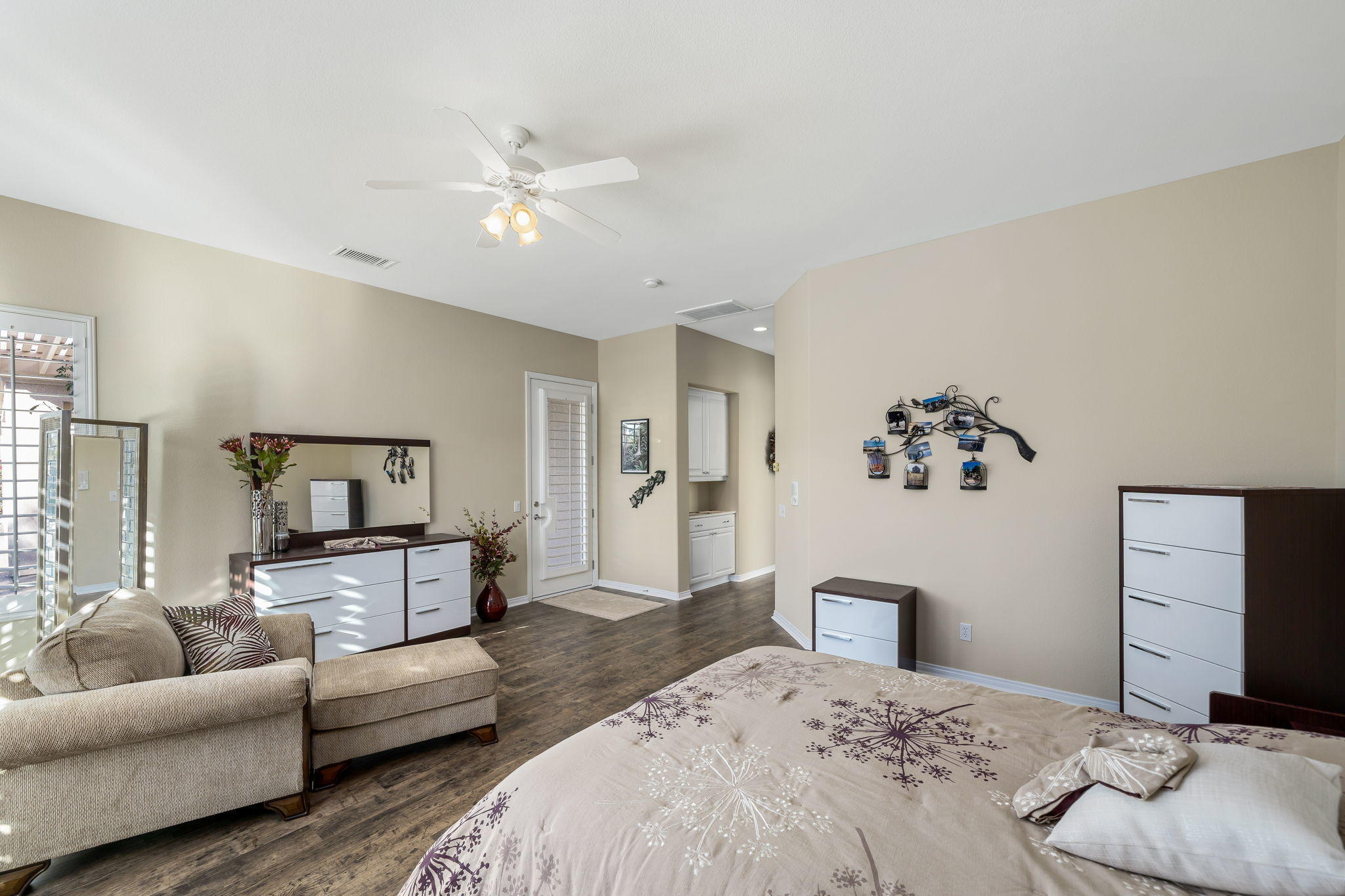 1 Orleans Road Rancho Mirage, CA 92270 - Photo 41 of 50 a bedroom with a bed couches and a flat tv screen