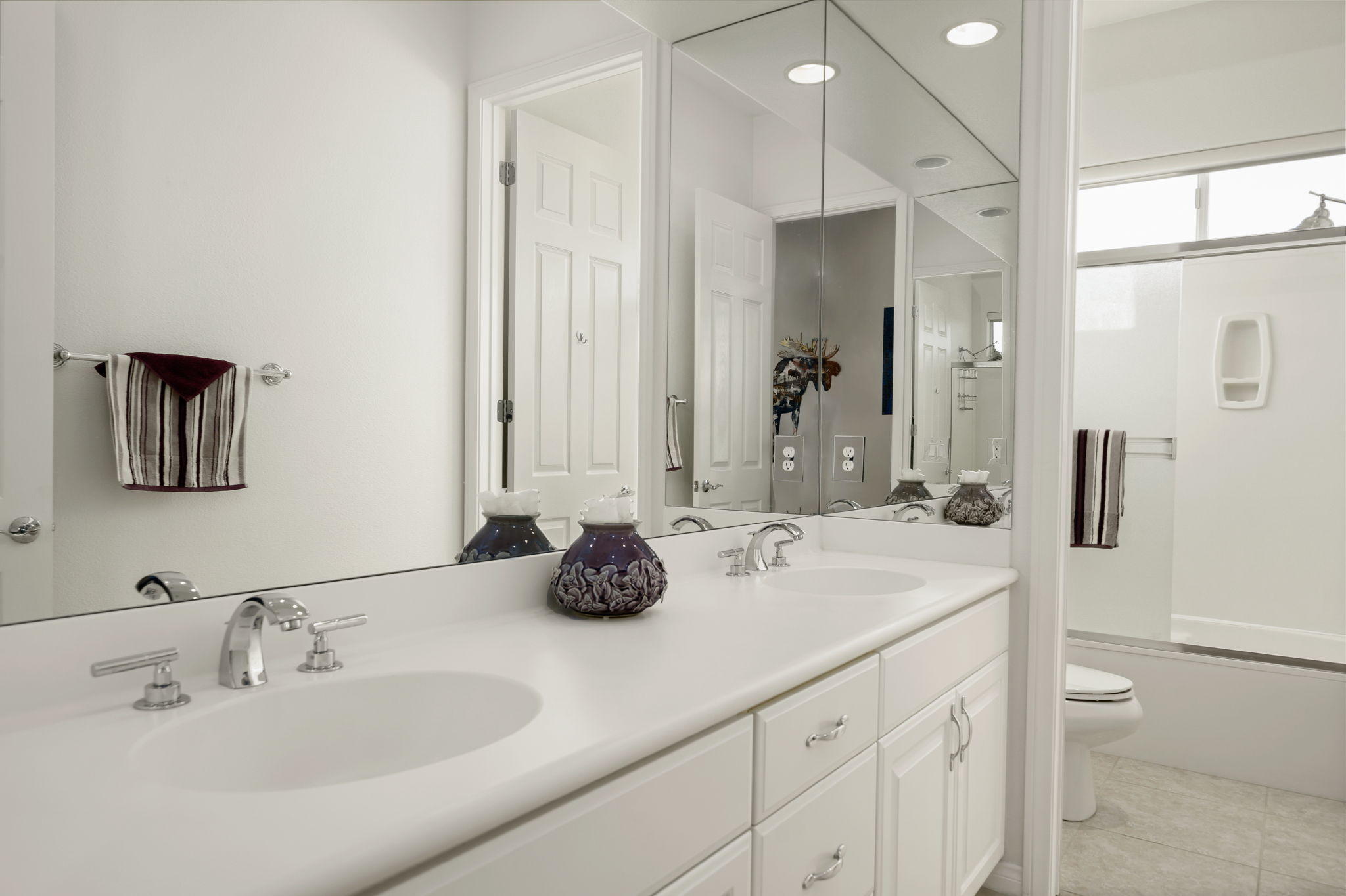 1 Orleans Road Rancho Mirage, CA 92270 - Photo 45 of 50 a bathroom with a sink double vanity and a mirror