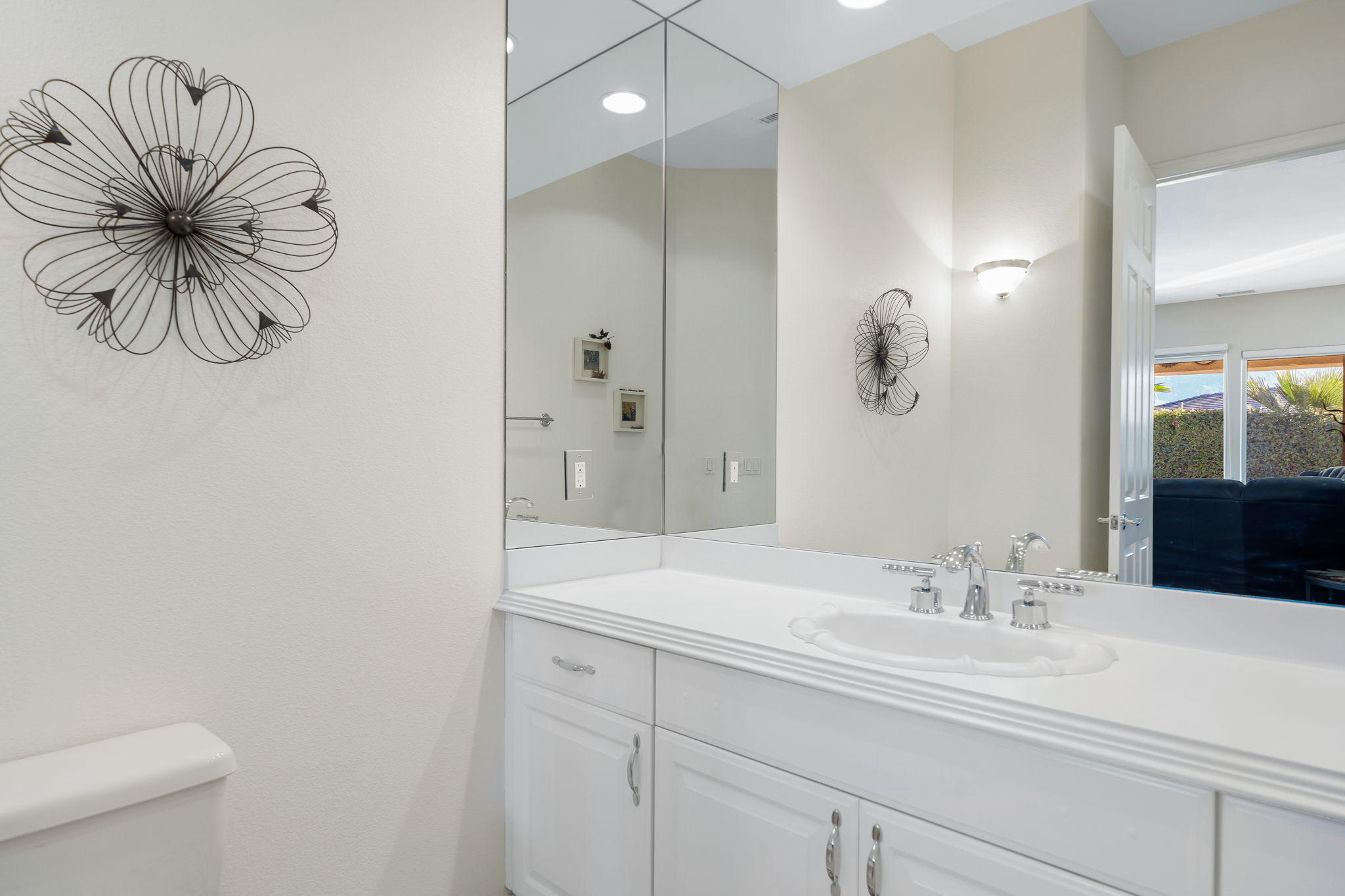 1 Orleans Road Rancho Mirage, CA 92270 - Photo 49 of 50 a bathroom with a sink a toilet and a mirror